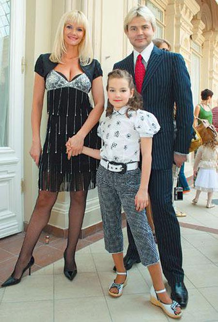 Андрис Лиепа и жена Екатерина с дочерью